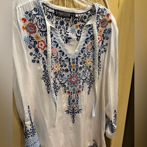 The Pyramid Collection White Tunic with Navy and Multicolor Floral Embroidery.